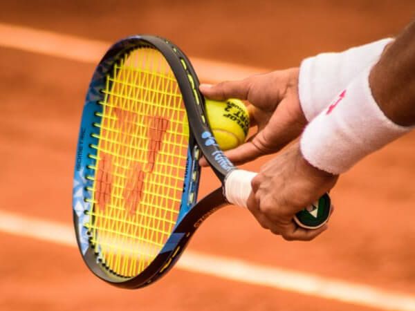 image of a tennis player about to serve